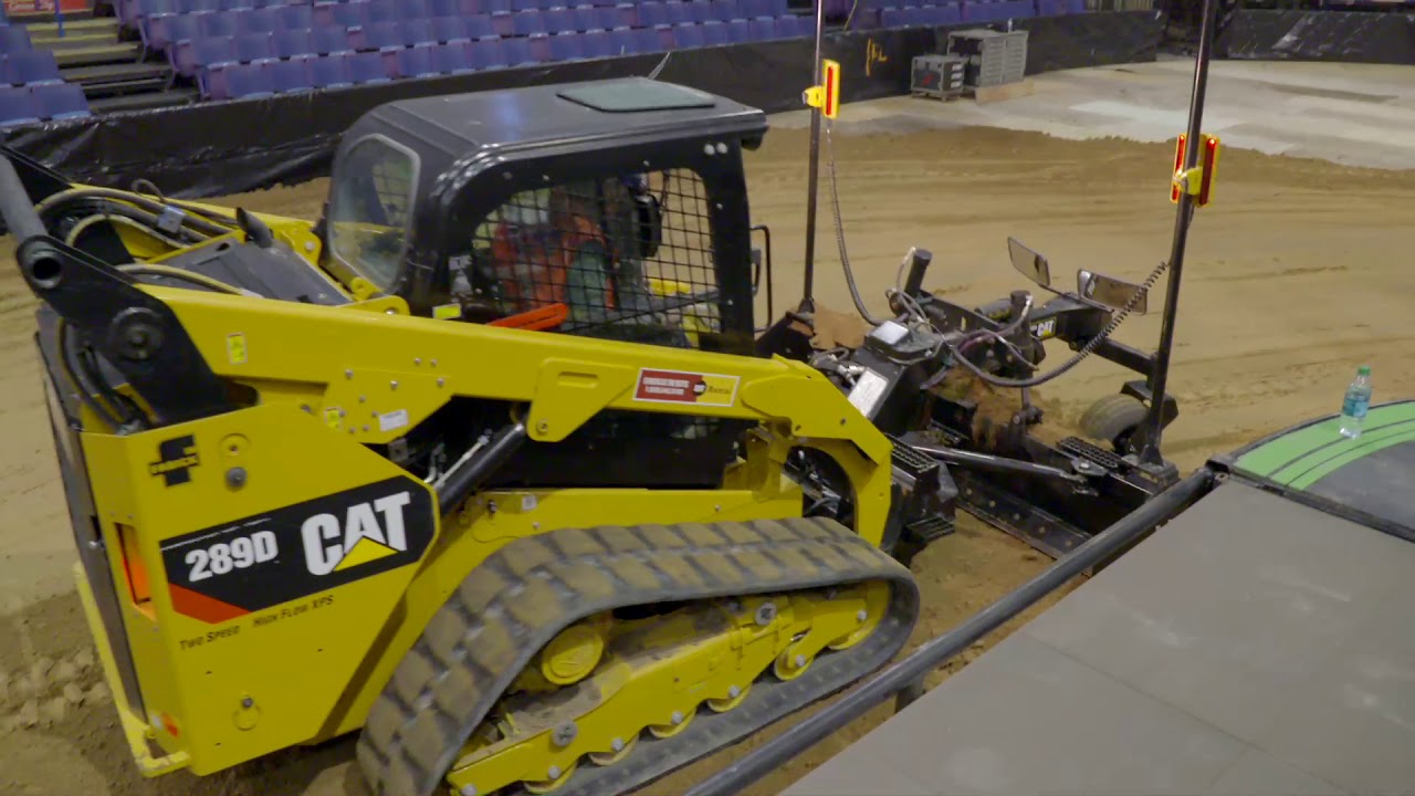 Cat® Box Blade Working at the Professional Bull Riders Event