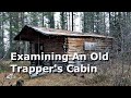 Examining An Old Trapper's Cabin