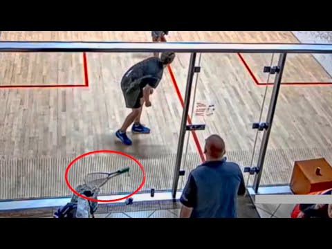 SQUASH. Drops his racquet but still wins the point