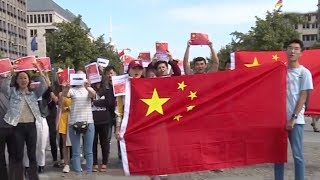Overseas Chinese across Europe rally against violence