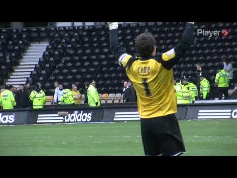 Lee Camp holding the Brian Clough Trophy aloft at Pride Park.