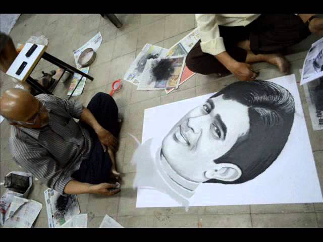 Beautiful portrait rangoli design by Mohan Sutar