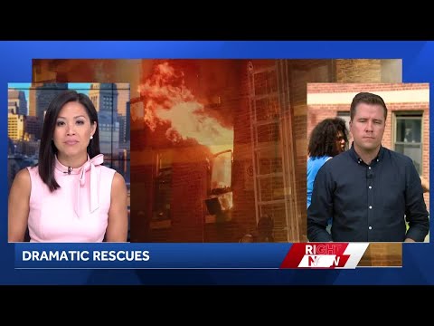 Residents jump out window of burning building to mattress below