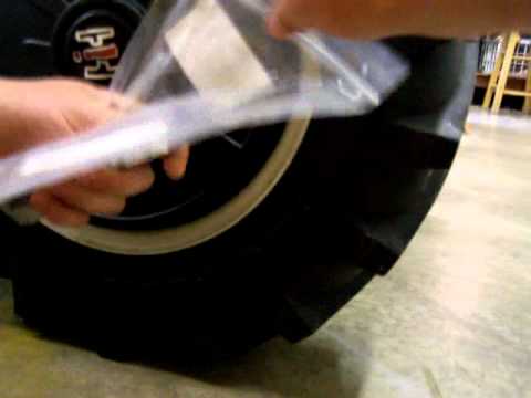 Putting on wheel weights on cub cadet 128 (1286A)