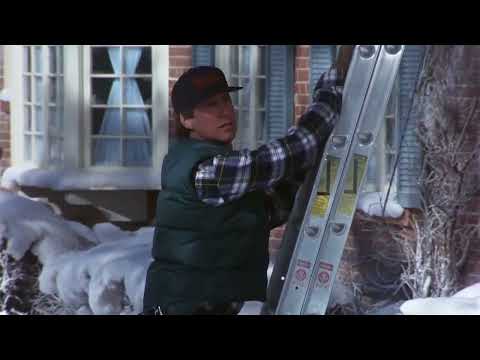 Christmas Vacation Clark starts putting up the lights on the house scene