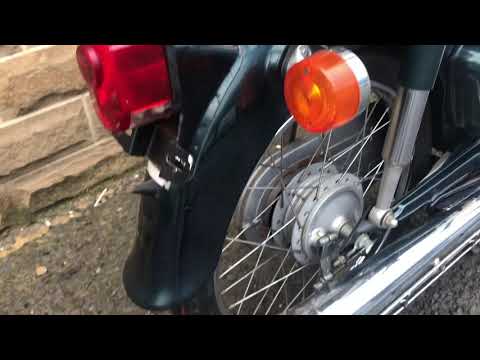 1999 Honda C50 in dark metallic green. Ref 2326