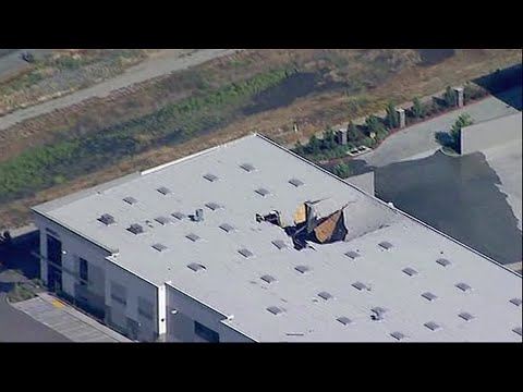 Military and civilian investigators are on the scene where an F-16 fighter jet crashed Thursday into a warehouse in southern California. The pilot ejected safely and officials said there were no serious injuries to warehouse workers. (May 17)