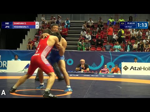 1/8 FS - 60 kg: S. SHARVAN (IND) df. T. YOSHIMURA (JPN), 9-6