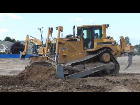 CAT D8T Bulldozer moving dirt around on a school construction site