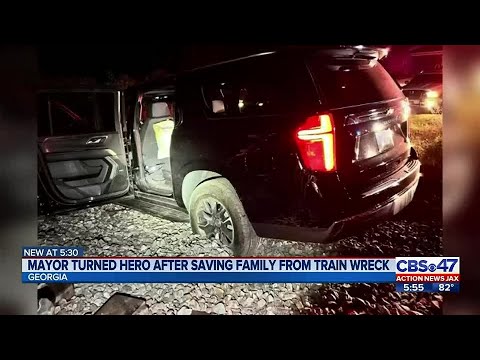 Mayor turned hero after saving family from train treck