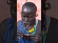 Woman from Surma tribe inserts lip plate | Omo Valley Ethiopia #shorts
