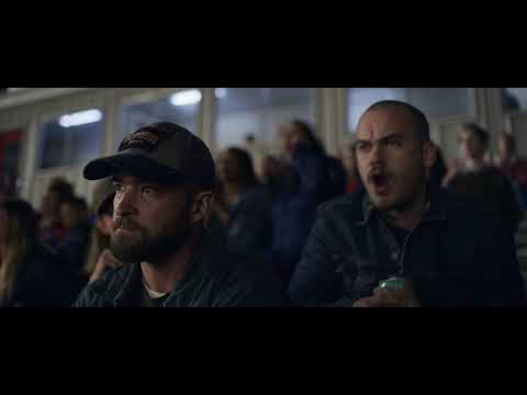 Trailer frame: end-credits sky over fields where the Rateliff song begins