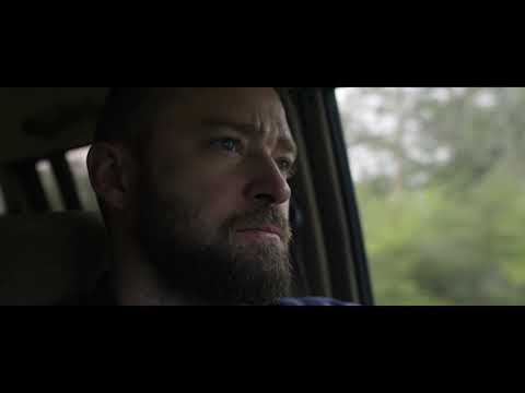 Palmer 2021 Apple TV+ trailer still: Justin Timberlake as Eddie walking down a rural road at dusk