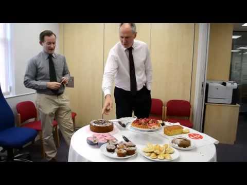 Neville Kyrke-Smith and John Pontfiex judging the "Bake Off" cakes for Syria @acn_uk office