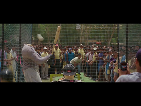 Million Dollar Arm trailer still with Jon Hamm against Indian skyline