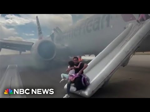 Video shows passengers evacuating American Airlines plane