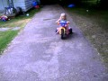 Katie Riding Her Dora Tricycle