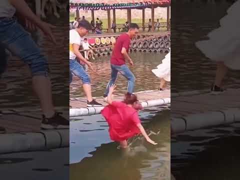 Epic Tumbles in Swing Bridge Game! 😂🌉💦 #WetlandWars 🌊 🥊 #SwingAndSoak 🌉💦 #WobbleWonderland 🌉🌀