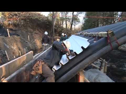 Hybrid Composite-Concrete Bridges