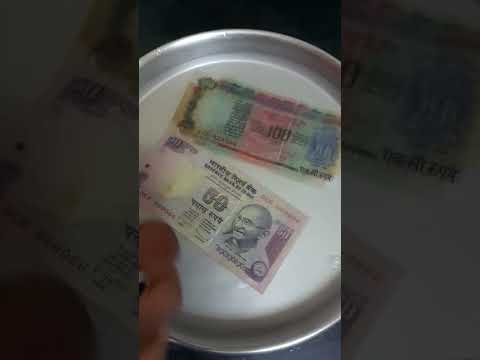 currency notes full of oil, cleaned with baking soda hot water.