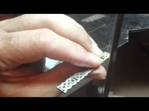 Hand making a Celtic wedding ring