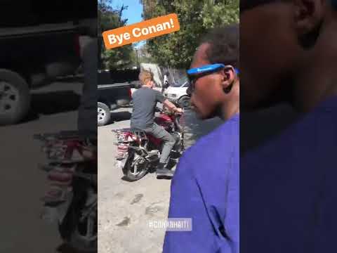 Conan riding a motorcycle in Haiti