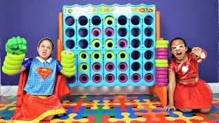 Superhero Kids! Supergirl vs Iron Girl  Giant Connect 4 Toy Challenge - Shopkins Num Noms Gross Toys