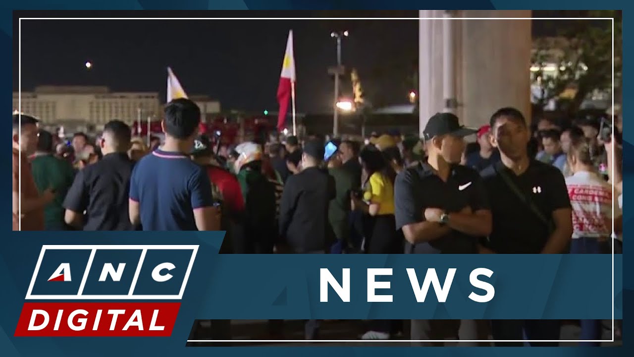 LOOK: Dozens of Duterte supporters remain outside Villamor Airbase as Duterte boards plane | ANC