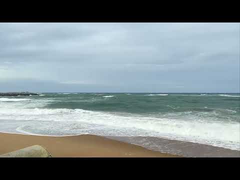 Gentle Waves on a Small White Rock Beach