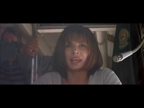 Official Speed (1994) trailer frame: LAPD squad, exploding elevator, and freeway chaos