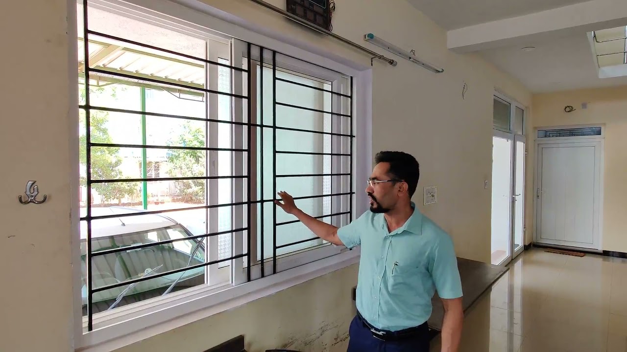 Watch video GADLI UPVC SLIDING WINDOW WITH INTEGRATED GRILL AND SS MESH Now GADLI UPVC SLIDING WINDOW WITH INTEGRATED GRILL AND SS MESH