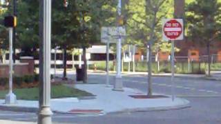 2 Hudson Bergen Light Rail Trains crossing various Newport Jersey City Streets