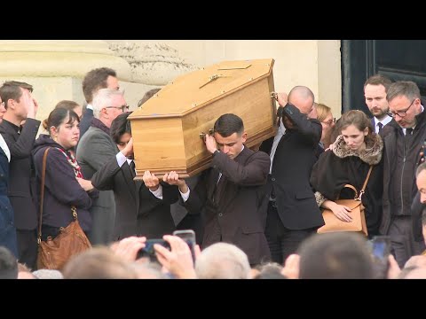 Coffin of French student buried near Paris leaves Versailles Cathedral | AFP