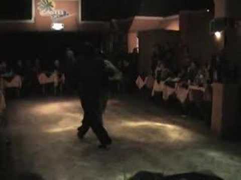  Andres Laza Moreno  and  Samantha Dispari  are  dancing  to  the  tango  "  "La Bruja, Sacale Punta, Esa Noche de Luna"  "