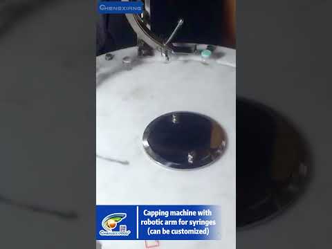 Capping machine with robotic arm for syringes | Syringe Filling Machines - Vials and Cartridges
