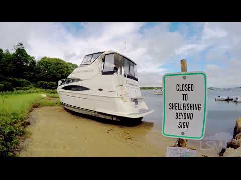07-09-2021 Barnstable, MA - 36-Foot Cabin Cruiser Washes Ashore During Tropical Storm Elsa