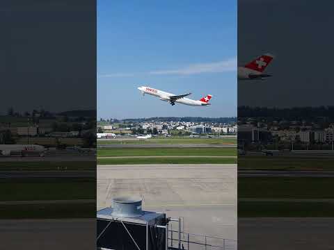 Airplane take off runway 16 and planespotters at Zurich airport. Filmed from observation Deck B.