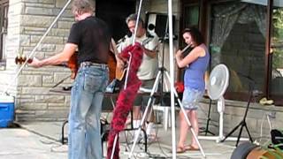 Toria playing flute with J.J. Band, August 2010