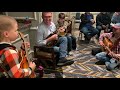 Alan Bibey jamming with young pickers at SPBGMA 2022