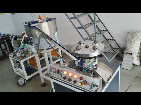 Automatic Bottle Caps Lining Machine video by Machmate Industries