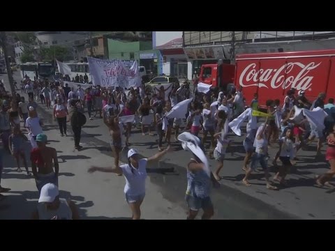 Hundreds protest in Brazil at a favela complex after gun battles kill at least four people
