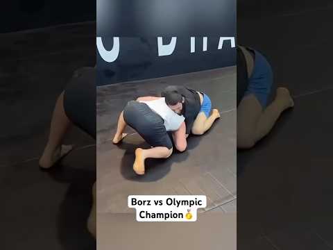 Khamzat Chimaev grapples with Razambek Zhamalov