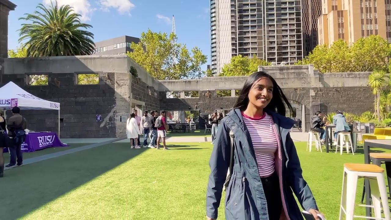 A student walks across RMIT's City campus.