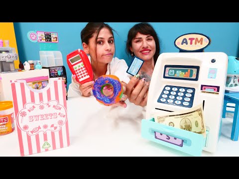 Ayşe ve Ümit ile kız oyunları. Ümit ATM den para çekip ödeme yapıyor. Market oyunu