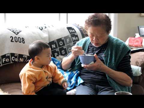 The Little Guy Eating Congee with Grandma, 10 Months and 3 Weeks Old
