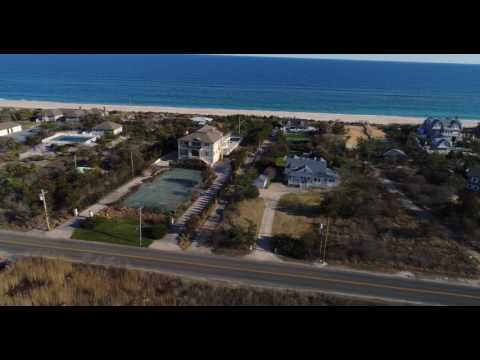 Low flight along lavish oceanfront estates and cottages viewed from Dune Road, Quogue, NY