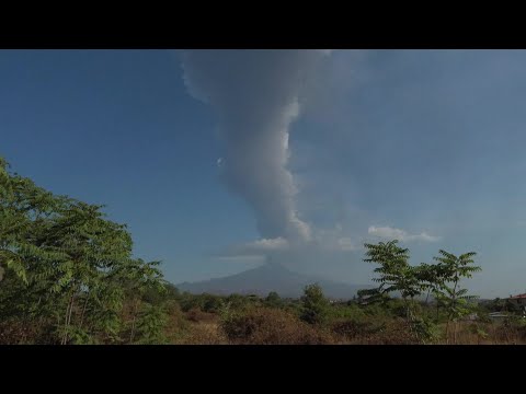 Italy's Mount Etna spouts clouds of smoke and ash as it erupts once again | AFP