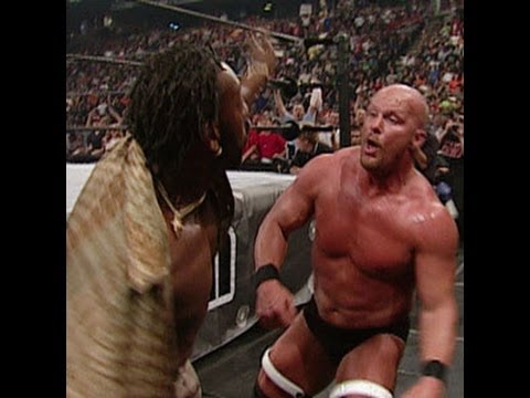 Booker T attacks "Stone Cold" Steve Austin, starting the