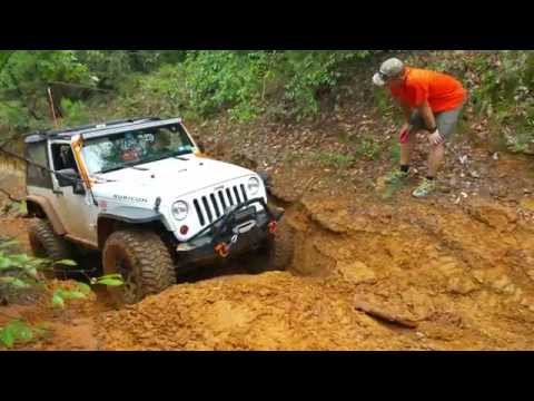 Jeep JK Wrangler Rubicon on 37s climbing at Barnwell Mountain Gilmer, Texas