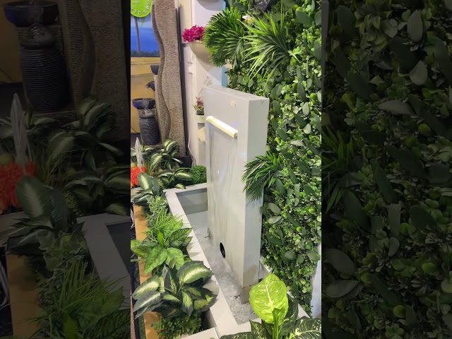 شلال بمصب مع اضاءة واحواض زرع مميزة